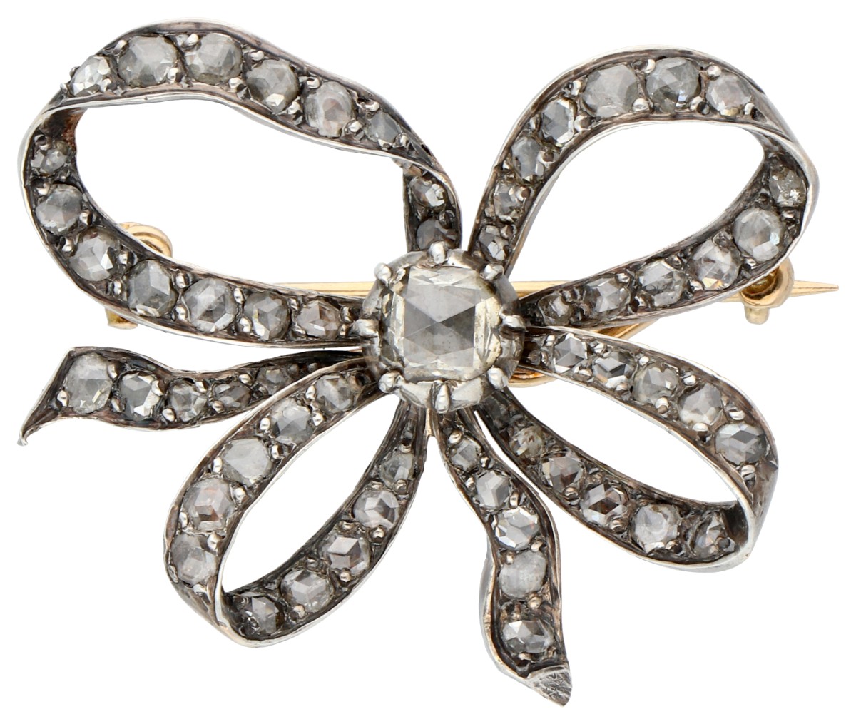 Gouden-zilveren antieke strikbroche bezet met diamant